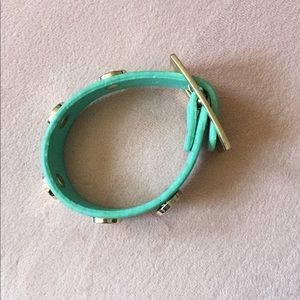 Teal bracelet with gold buckle and studs